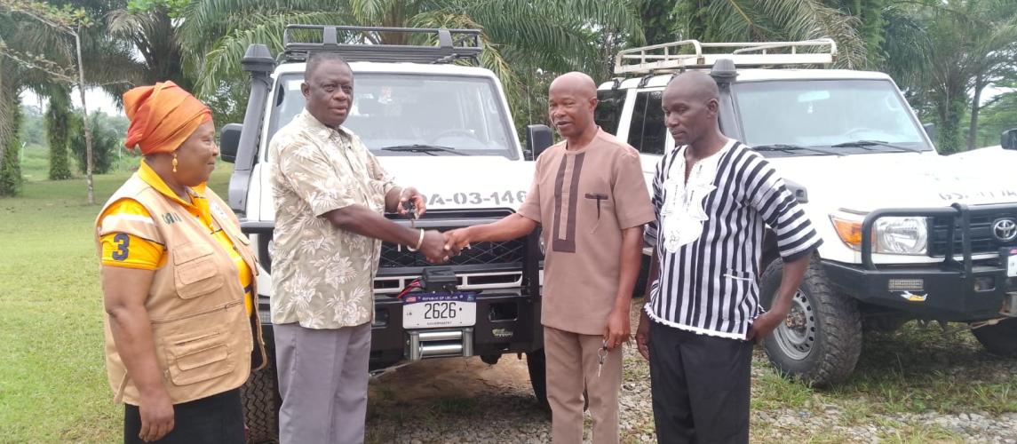Dr. Arthur Bob. Karnuah, receives keys of Toyota Land Cruiser SUV from, Mr. Jobson A. Momo, SDCA.