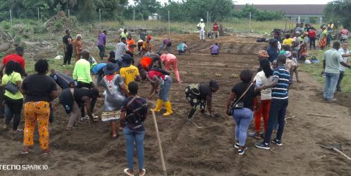Farmers carrying out soil amendments using the biochar technology transfer at the RESADE - CARI Best Practice Hub near the Grand Bassa University campus in Buchanan