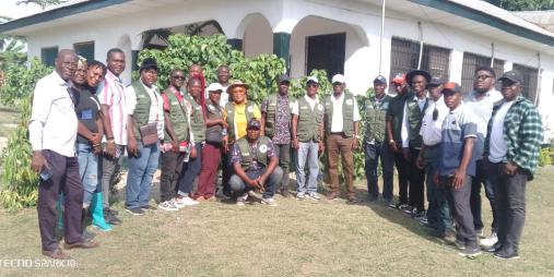 The arrival of Director General Dr. Arthur Bob Karnuah, accompanied by CARI management staff and researchers, standing before the field office at the Beeplay hub in Buuyao District, Nimba County.   